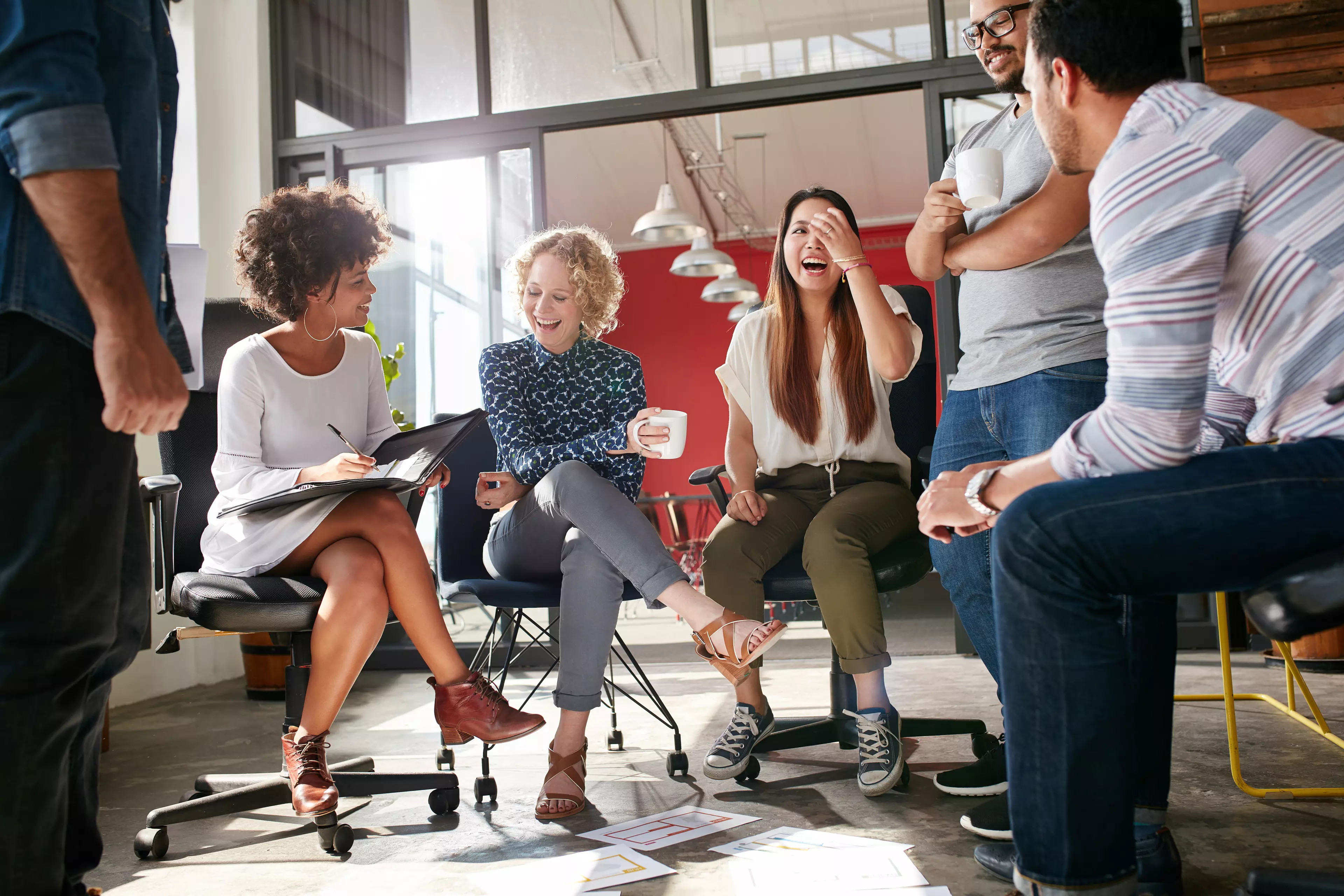  A group of happy coworkers during an informal work meeting.